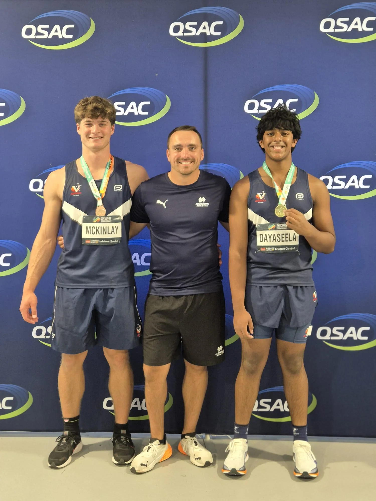 Michal Burian with developing discus athletes